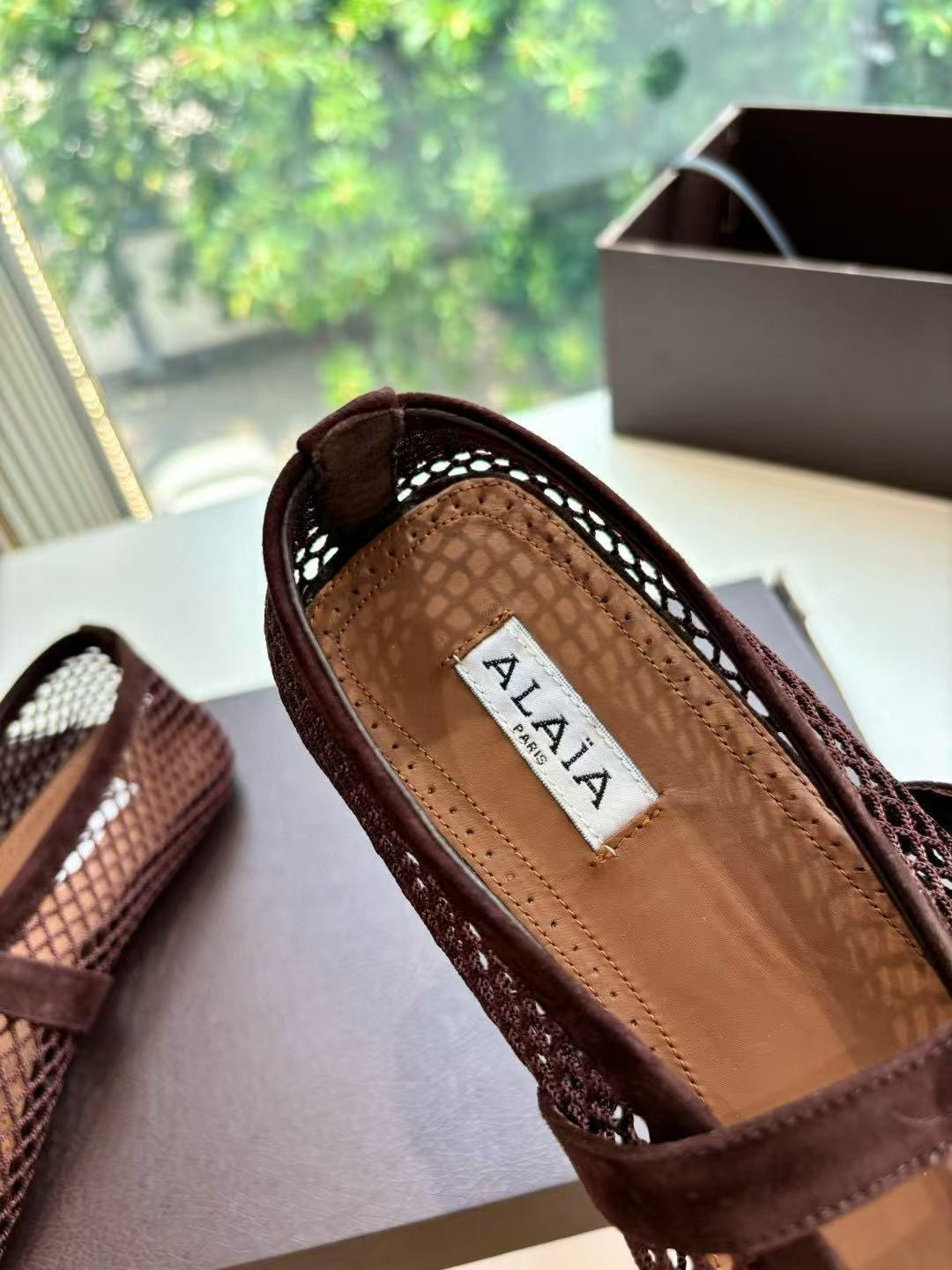 UA ALAÏA BALLET FLATS IN FISHNET